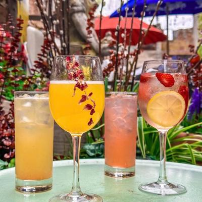 Selection of refreshing summer cocktails served in the outdoor setting.