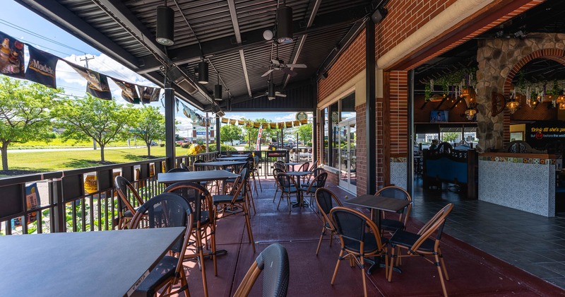 Outside, covered patio, dining tables and chairs