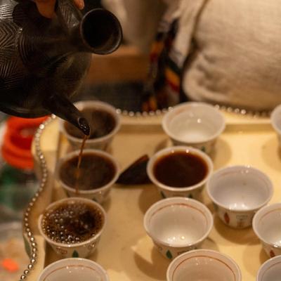 Pouring cups of coffee.