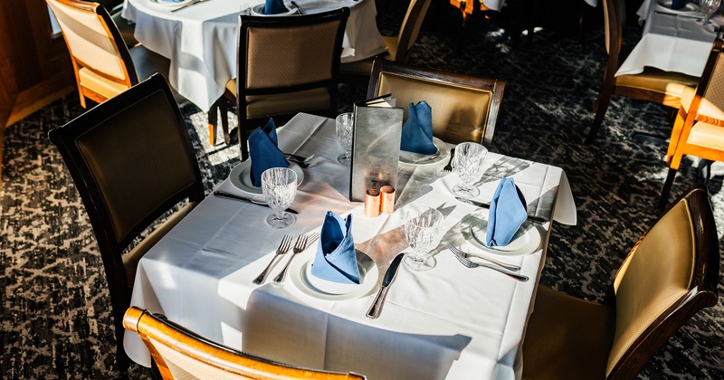 Dining table set for four guests