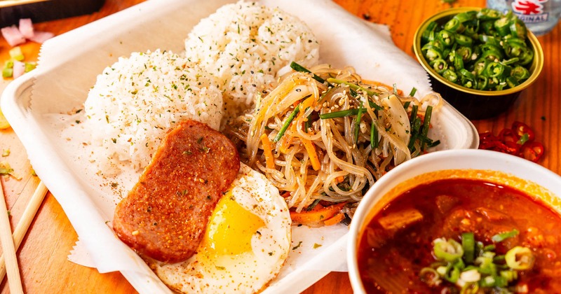 Fried egg, tofu, rice, kimchi, and noodles