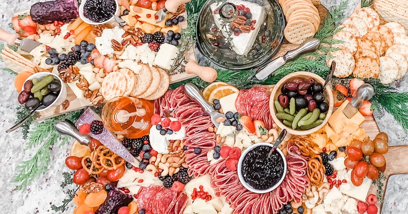 A large graze table with charcuterie boards, top view close up