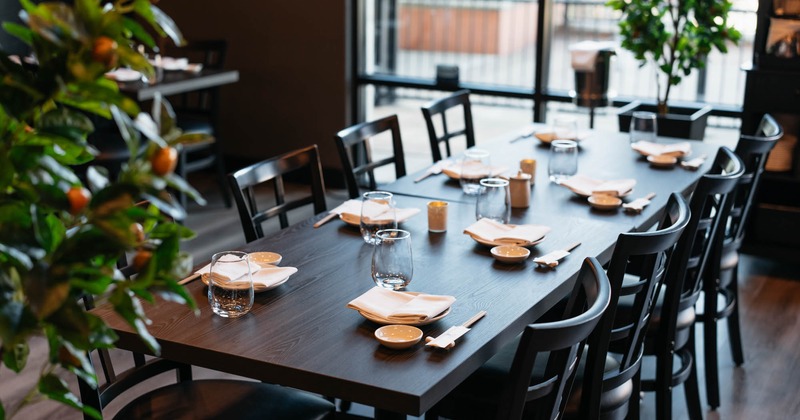 Interior, tables ready for guests, flower decorations