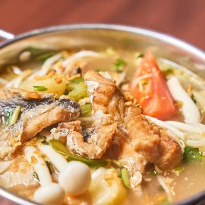 Tomato and pineapple soup with fish.