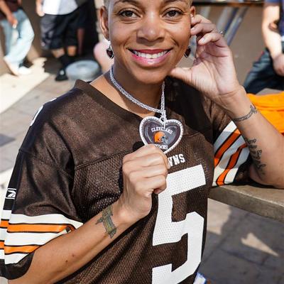 A smiling girl in a 5 jersey posing for a photo