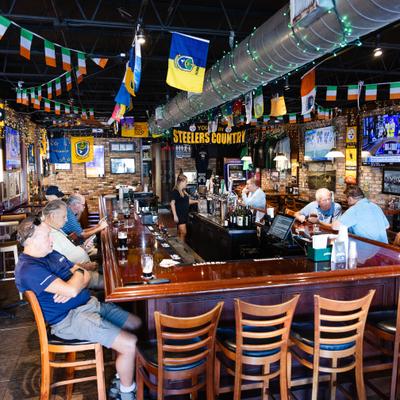 Customers sitting at the bar.