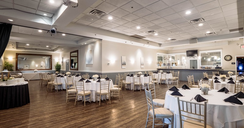 Event hall with round tables, white linens, and banquet seating