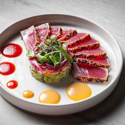 Tuna tataki platter with sauces.