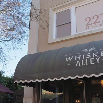 Restaurant exterior with awning and signage.