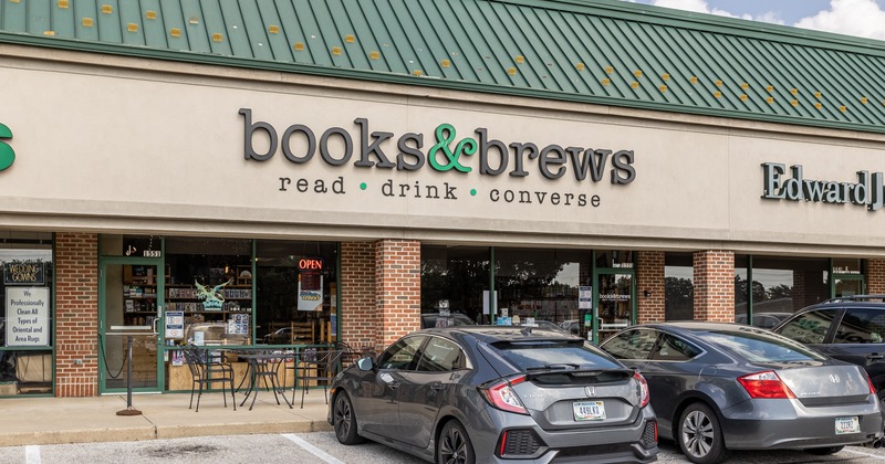 Exterior, front view, parking lot, entrance, sign above
