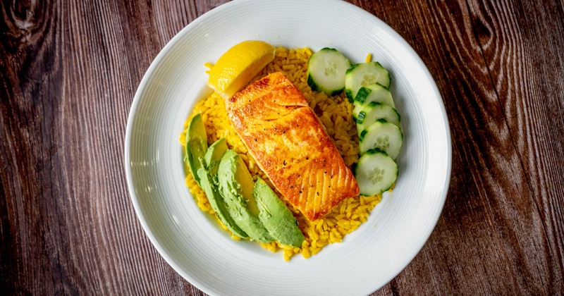 Salmon with rice, avocado, and cucumbers