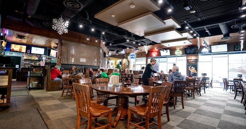 Interior space, guests, tables and chairs