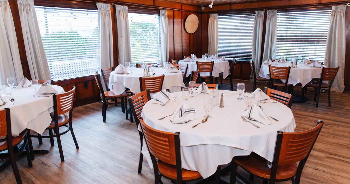 Interior, dining tables ready for guests
