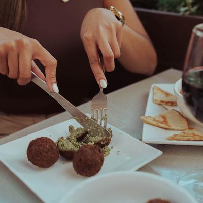 Eating arancini.
