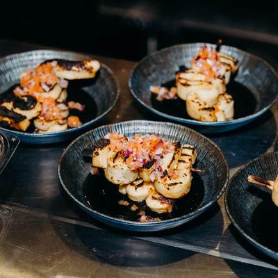 Plates of grilled seafood dishes.