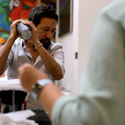 Bartender shaking a cocktail.
