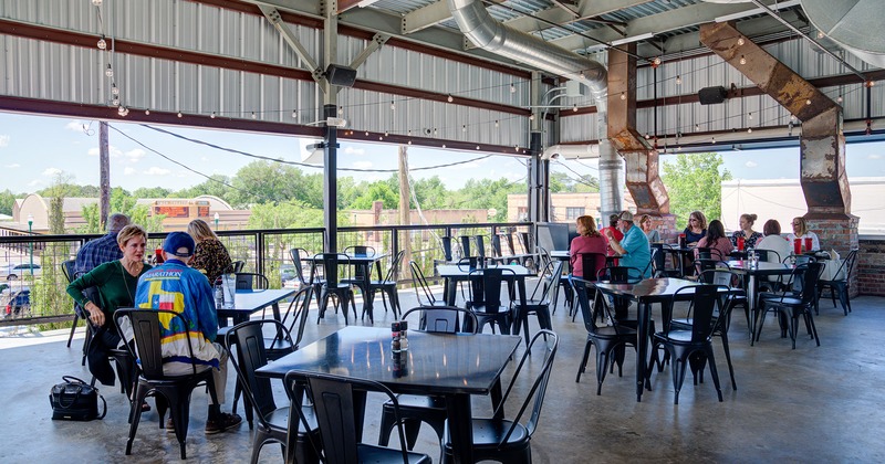 Covered patio with tables and chairs