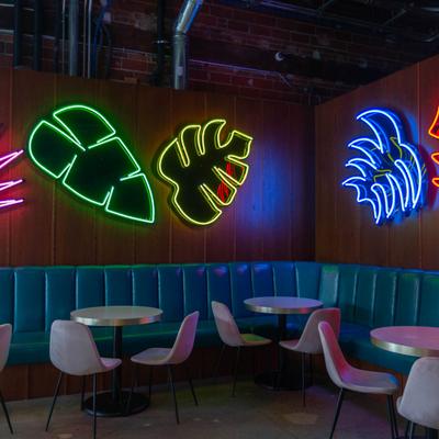 Interior, seating area with leaf shaped neon lights on the wall
