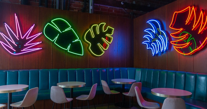Interior, seating area with neon decorations on the wall