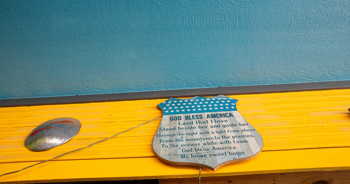 Exterior, sign above entrance, close up