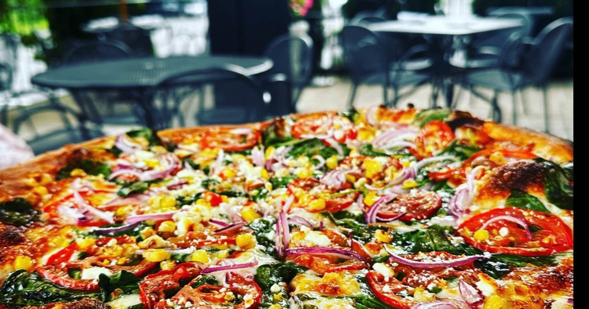 Fresh Summer Pizza w/ local corn, heirloom tomato's, spinach, & goat cheese