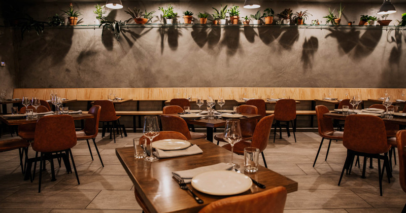 Interior, tables set with tableware