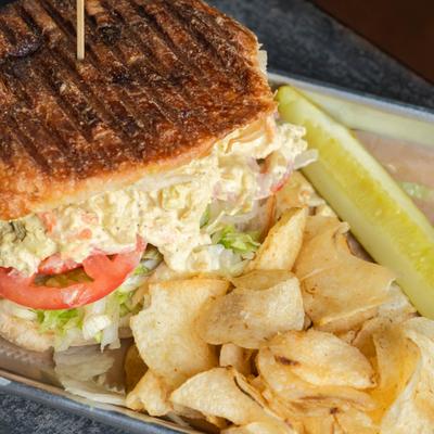 Curry Chicken Salad Sandwich and potato chips.