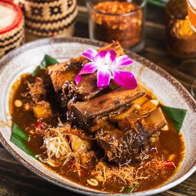 Short ribs in curry sauce, ginger, garlic, peanuts,a dn potatoes.