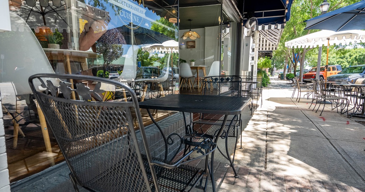 Exterior seating space with chairs and tables