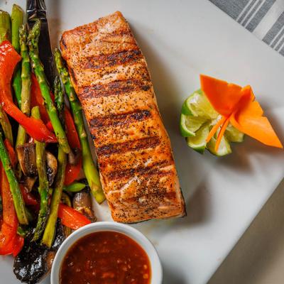 Grilled salmon with butterfly decoration on side