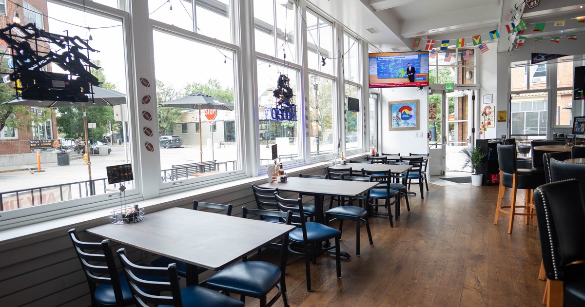 Interior, dining area, restaurant entrance, seating by the large windows
