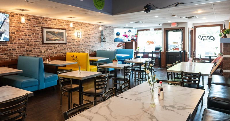 Interior, dining area, tables ready for guests