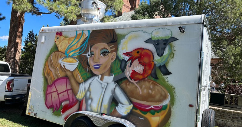 Food trailer with a colorful mural