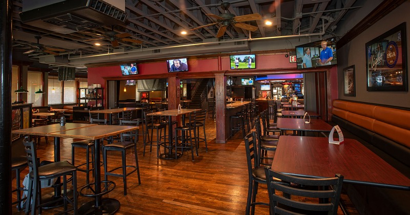 Interior, seating area with high tables and stools