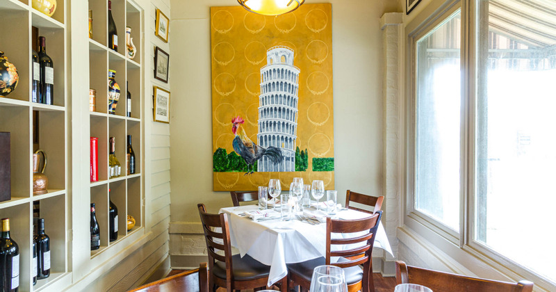 Interior, table by the window and a wall with a hanged painting
