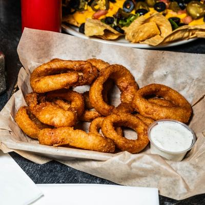 Basket of onion rings with homemade ranch.
