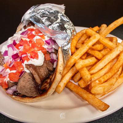 Gyro wrap topped with tzaziki, diced onion and tomato, served with fries.