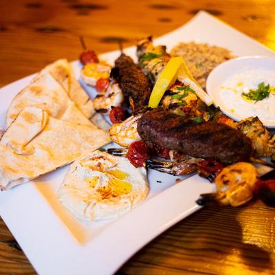 Chicken, shrimp and kefta kabobs with pita, hummus, tzatziki sauce and rice pilaf
