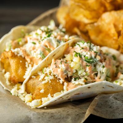 Fish tacos served with chips