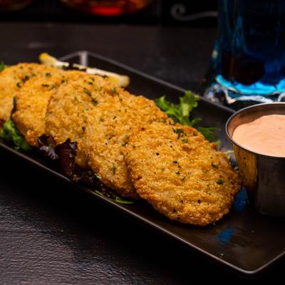 Fried Green Tomatoes with dipping sauce on the side.