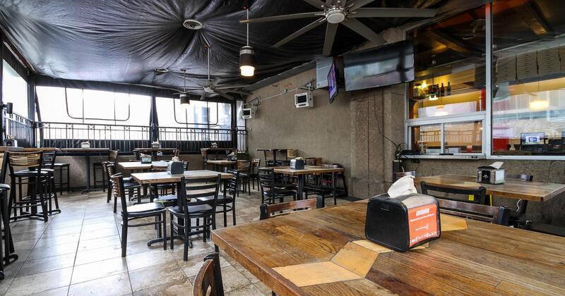 Interior, tables and chairs ready for guests