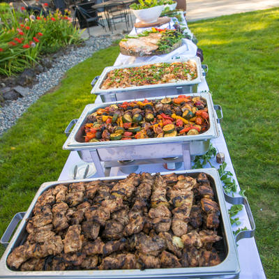 Four different dishes lined up on table