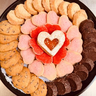 Variety of cookies arranged on the plate by type and color.