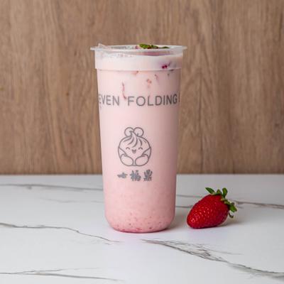 Cup of strawberry green tea latte.