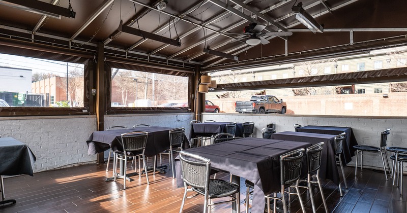 Covered patio with tables and chairs