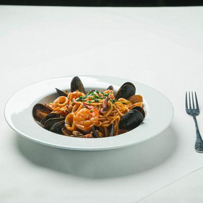 Spaghetti in tomato sauce, with clams, mussels, shrimp, and calamari.