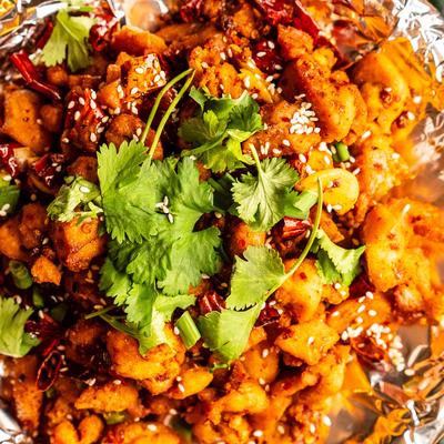 Sichuan Spicy Chicken with cilantro, closeup