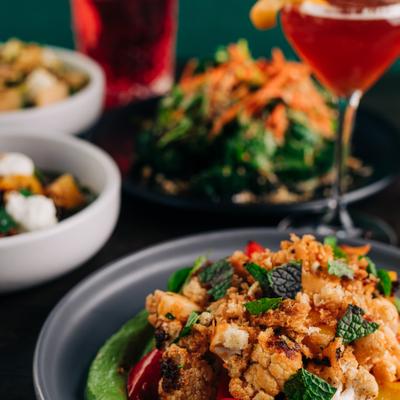 Multiple Plates including Roasted Cauliflower.