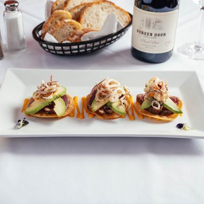 Tuna tostada plate served.