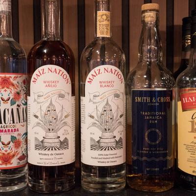 A selection of rum and whiskey bottles.